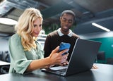 Group of people looking at a business phone