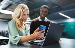 Group of people looking at a business phone