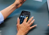 A person types on a calculator app